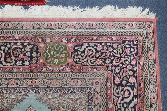 A Persian pattern rose ground cotton and silk rug 298 x 215cm